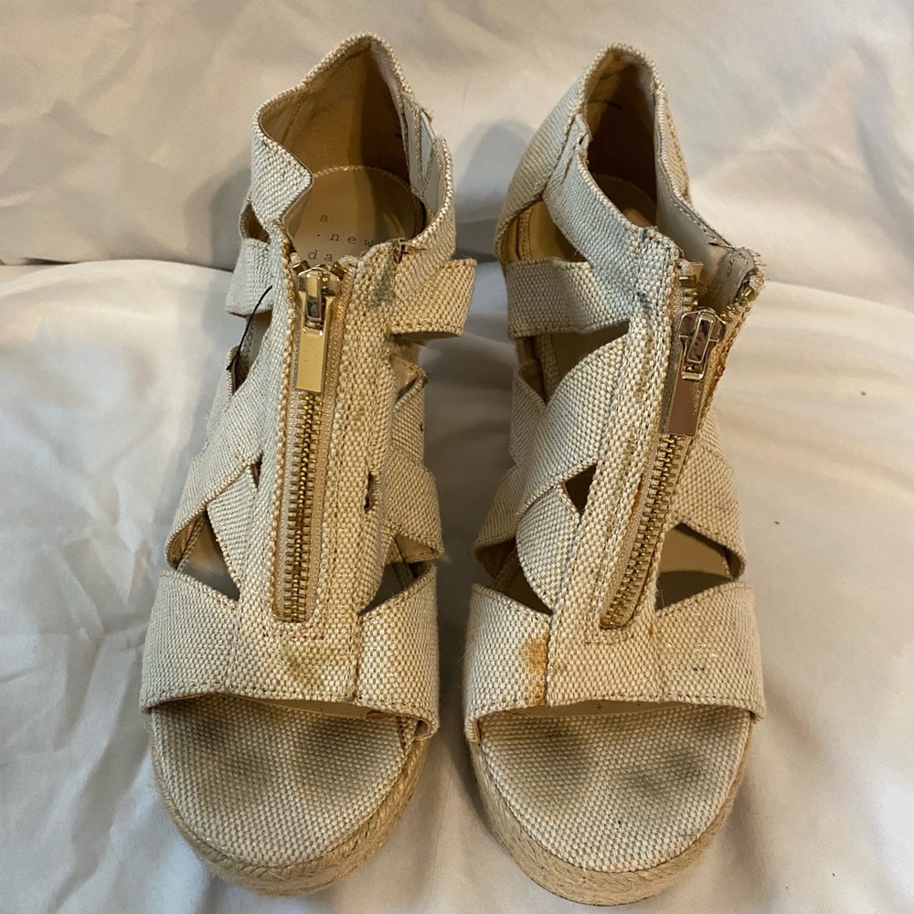 A new day cream and gold wedges size 6 normal wear and tear